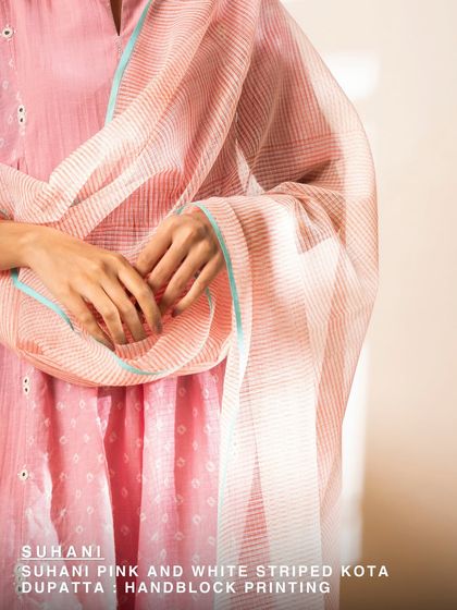 Our Suhani pink and white striped Kota dupatta, block printed on soft cotton. It’s the perfect accessory to add a touch of craft and color to any outfit on a warm day.
