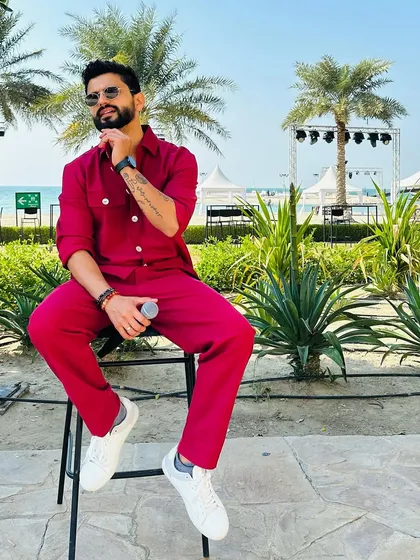 A vibrant red co-ord set, perfect for a beachside event. This look is all about standing out.