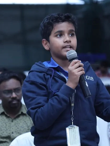 Confidence is built by having a voice. This young innovator is captured engaging with the audience at a competition, asking thoughtful questions. We empower students to not just build projects but to also lead conversations and think critically about technology.