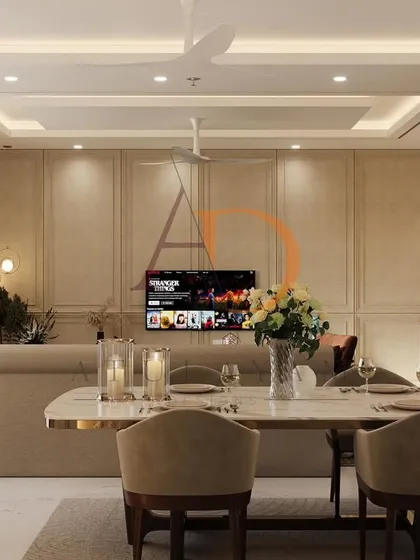 A view from the dining table highlights the open layout, where the paneled TV wall and elegant furniture create a sophisticated backdrop for both daily living and formal gatherings.