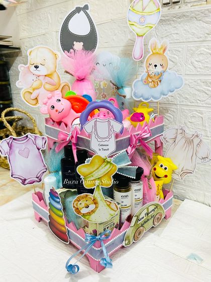 This heart-shaped hamper is a beautiful way to welcome a new baby, filled with toys, rattles, and essentials for both baby and parents.