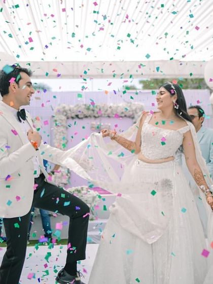 A confetti blast makes for a picture-perfect and joyous entry for the newly engaged couple.
