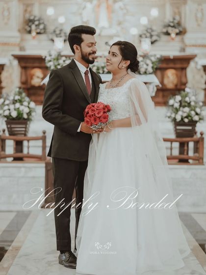 The couple standing together in the church, "Happily Bonded" in a moment of love and commitment.