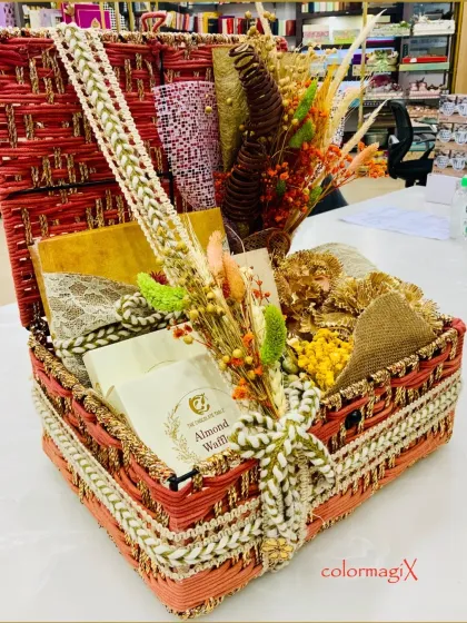 The magnificent red woven trunk, tied with a beautiful rope ribbon. This hamper is designed for those who want to give a gift that is both traditional and opulent.
