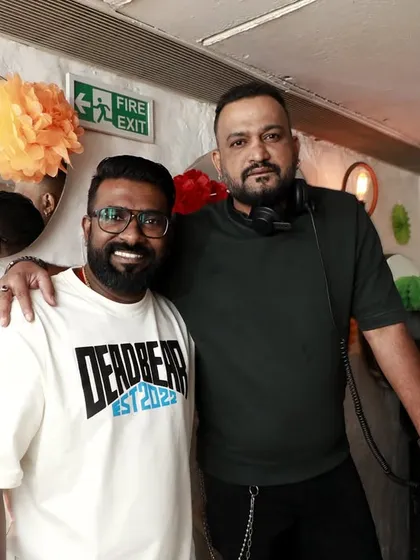 Posing for a photo with a friend during O' Bar Night. It's not just about the music, it's about the community and the people who come together to share the vibe.