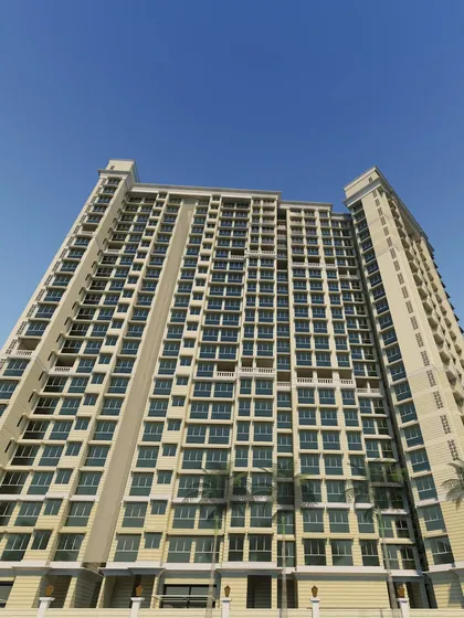 A worm's-eye view of the 22-story residential tower in Powai, emphasizing its verticality and commanding presence. The facade's clean lines and uniform windows create a sense of modern, structured living.