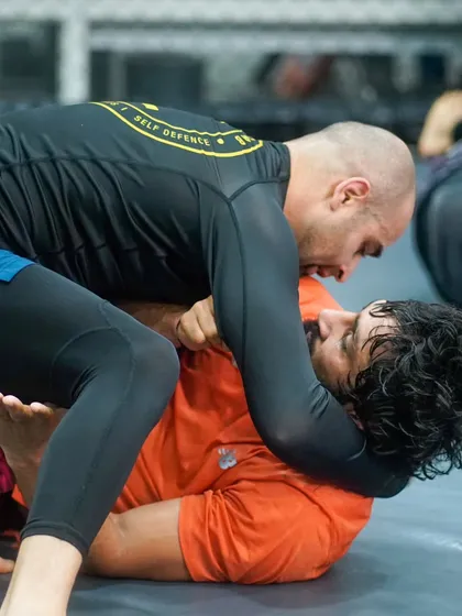 A close-quarters battle for position during a No-Gi roll. This is where you learn to control the fight, using pressure and technique to dominate your opponent.
