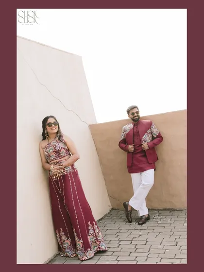 A fun, stylish portrait of the couple. Her relaxed lean and his confident pose perfectly capture their cool, modern vibe at this carnival event.