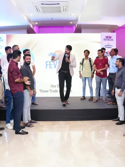 Getting the dealers on their feet for an interactive session. Even in a formal setting, I find ways to incorporate light activities to keep the energy levels high and the audience attentive.