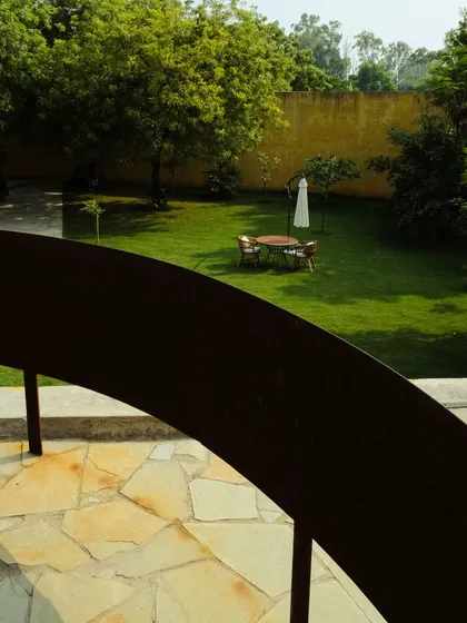 A view from the spiral staircase looking out over the private garden, a quiet space for guests to enjoy.
