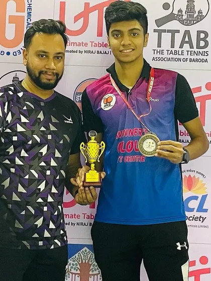 Another photo with Aakash and his winnings from the Vadodara tournament, celebrating his consistent performance.
