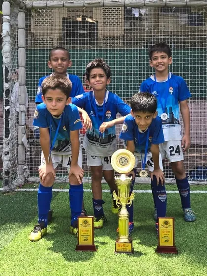 Our U-9 champions posing with their trophies after a fantastic tournament performance.