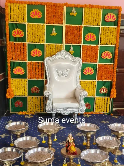 For a traditional baby shower or Seemantha, I set up a special throne for the mother-to-be. The backdrop here is made with a grid of fresh marigolds and auspicious lotus motifs.