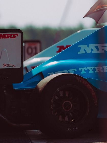 A detailed shot of the MRF Tyres branding and the aerodynamic bodywork of the F1600 car.