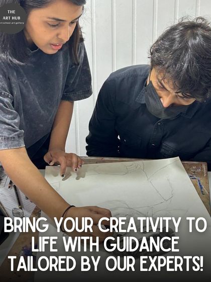 An instructor provides detailed guidance on a pencil sketch, helping a student refine his drawing skills with expert, one-on-one attention.