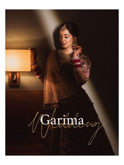 A beautifully designed portrait with the bride's name, perfect for a wedding album cover, showcasing her elegance in moody lighting.