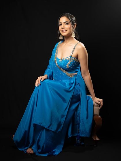 Another seated pose, highlighting the beautiful details of the outfit and my readiness for the event.