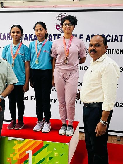 Our 10M Air Pistol women's team on the podium after a successful competition.