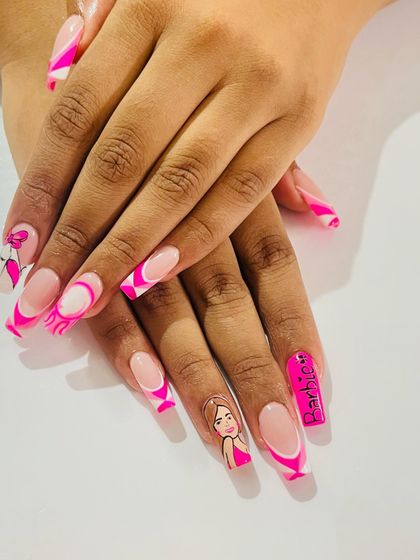 The full Barbie nail set, complete with a portrait, the Barbie logo, and fun pink swirls.