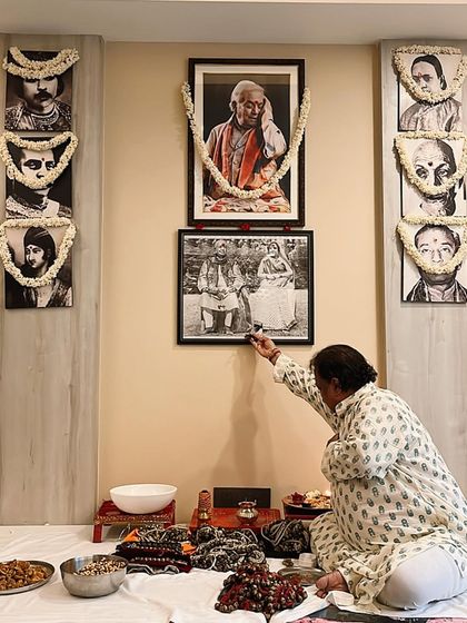Pt. Jai Kishan Maharaj performing the Guru Purnima puja, paying respects to the lineage of Gurus whose portraits adorn our walls. This is a sacred day where we honor our teachers and our tradition.