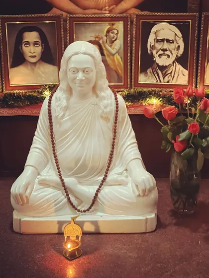A marble statue of Mahavatar Babaji, the deathless master who revived the ancient science of Kriya Yoga for this age. His silent presence is a source of immense power and grace.