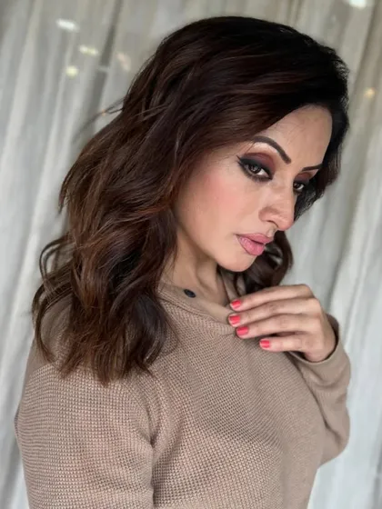 This client is serving serious looks with her new hair. The combination of the rich brown colour and smokey eye makeup is a total power move.