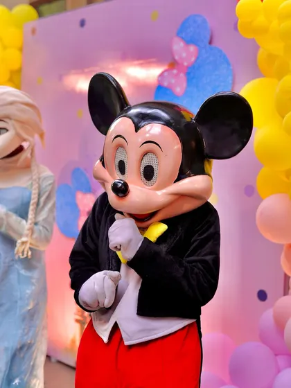 A close-up of the Mickey Mouse mascot, ready to bring smiles and magic to a child's birthday party. The high-quality costume ensures a believable and enchanting experience for the kids.