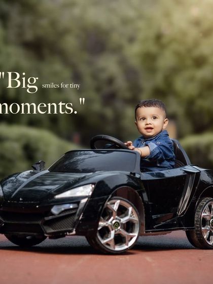 Big smiles for tiny moments. This happy toddler is having the time of his life in his toy car.