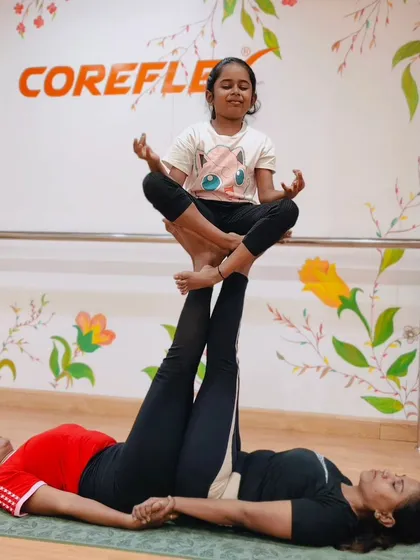 A beautiful moment of trust and balance in our parent-child partner yoga. We love seeing families flow and grow together on the mat.