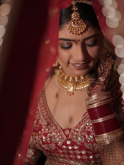 Another beautiful portrait of Bhawna. The focus here is on her flawless skin and the intricate details of her bridal jewellery and henna.