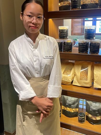 One of our talented team members standing proudly in front of our retail display. It is the hard work of individuals like her that ensures our products are always of the highest quality.