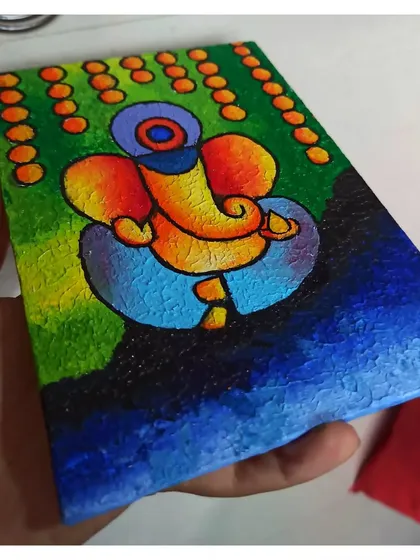 I love adding a modern twist to spiritual art. This abstract Ganesha is painted on a textured canvas, using bold colors and a unique style to create a vibrant piece of devotional art.