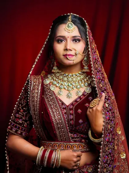 A confident pose from the model, showcasing the student's excellent work. The makeup is perfectly balanced with the heavy jewelry and outfit.