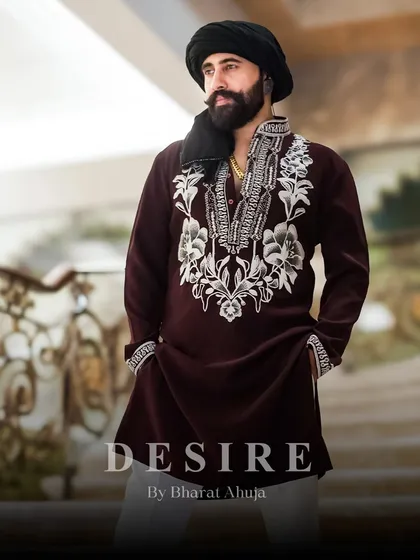 A look that embodies festive power. This maroon and ivory kurta is the perfect ensemble for any celebration where making a sophisticated and memorable impression is key.