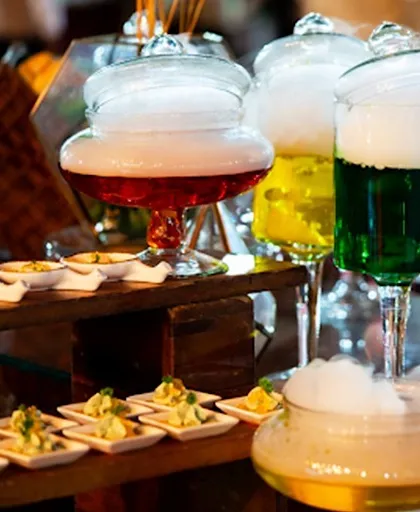 Our beverage stations are a visual spectacle. Here, smoky mocktails are presented in unique glassware, using molecular gastronomy techniques to create drinks that are as exciting to watch as they are to taste.