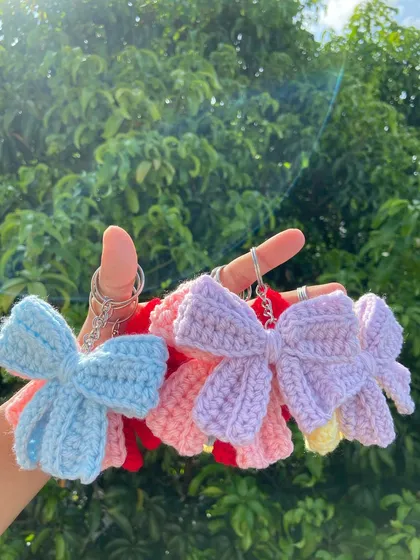 A collection of my crochet bow keychains in various colors. These are a simple yet elegant accessory, perfect for a wide range of customers.