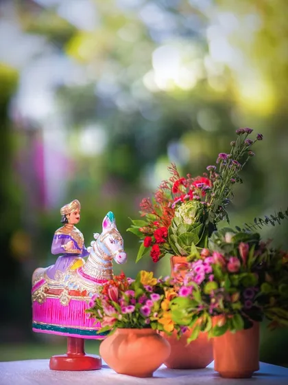 A traditional Kondapalli doll, used as a decorative element at a Pellikuthuru ceremony, adding a touch of Andhra culture and artistry.