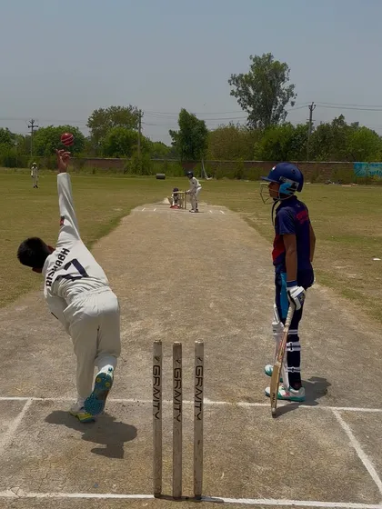 A bowler in action during a match, on his way to a 4-wicket haul.