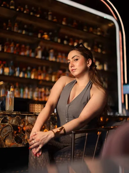 A classic influencer shot that sets the scene. Posing at the stylish bar of CAD Noida, I showcase the ambiance and vibe of the place, helping my followers picture themselves enjoying a drink there.