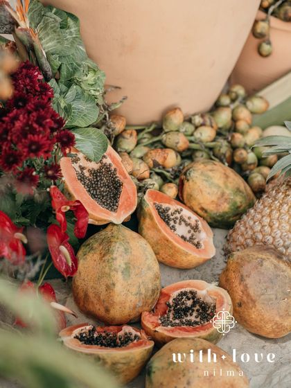 A close-up of the tropical fruit and floral installation, showcasing the rich colors and textures of the local produce.