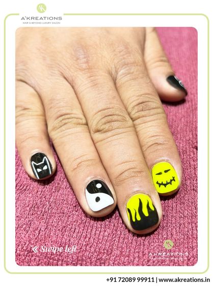 This view highlights the spooky-themed nails, including the Batman logo, a ghost face, and flame art, perfect for Halloween or a bold statement.