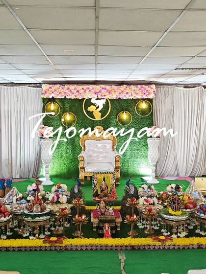 A wide view of a baby shower setup in a large hall, showing how my decorations can fill and transform a space.