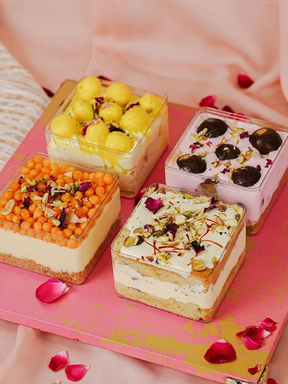 A modern twist on classic sweets. Our Mithai Trifles, including Gulab Jamun Cheesecake and Kesar Rabdi Tres Leches, are a unique Rakhi treat.