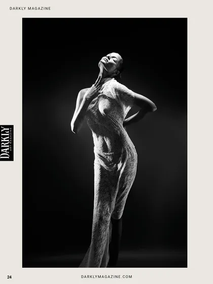 Black and white strips everything back to pure form and emotion. In this shot for Darkly Magazine, the lighting sculpts the body, creating a living statue. It’s a poetic interplay of shadow and form, capturing a moment between tension and release.