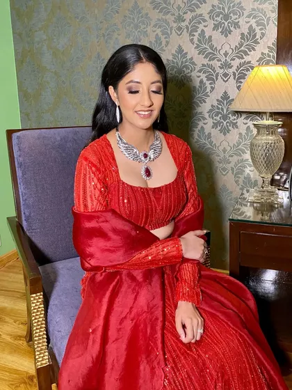 A close-up of Pooja's soft and glamorous makeup. The look is timeless and beautiful, perfect for any evening event.