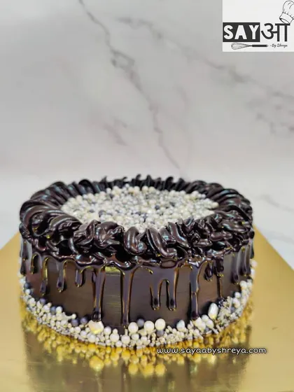 I had fun making my own edible silver beads for this double chocolate cake. The rich chocolate drip and swirls are complemented by the crunchy, shimmering beads for a unique texture.