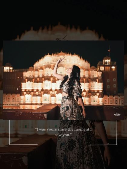 A solo portrait of the bride in front of Hawa Mahal at night, her pose echoing the elegance and grace of the palace itself.