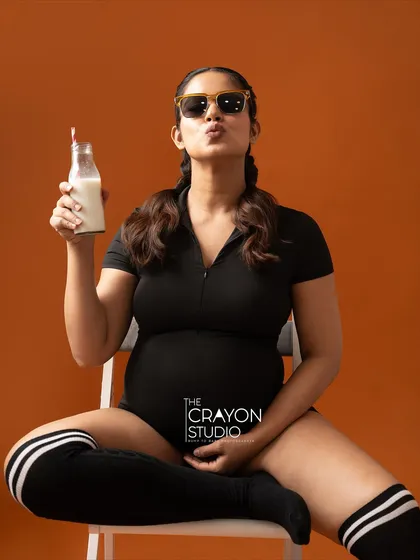 Your maternity shoot should be a reflection of you. This fun, sporty theme was a quirky idea we brought to life in the studio, proving that pregnancy photos can be playful, strong, and full of personality.