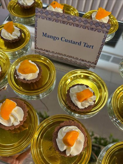 A beautiful display of our Mango Custard Tarts. The sweet mango and creamy custard in a buttery tart shell make for a perfect bite-sized dessert.