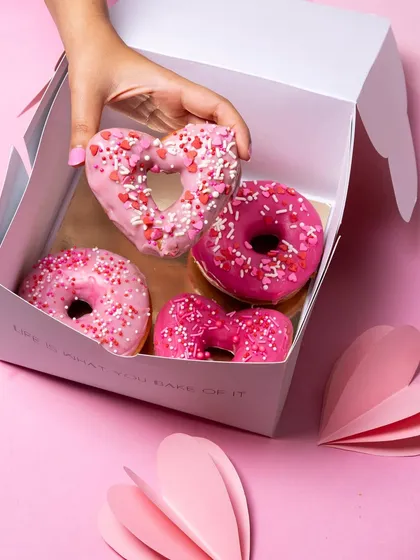 My Valentine's special box of 4 glazed donuts, including a cute heart-shaped one. They are fluffy, eggless, and handmade with love.